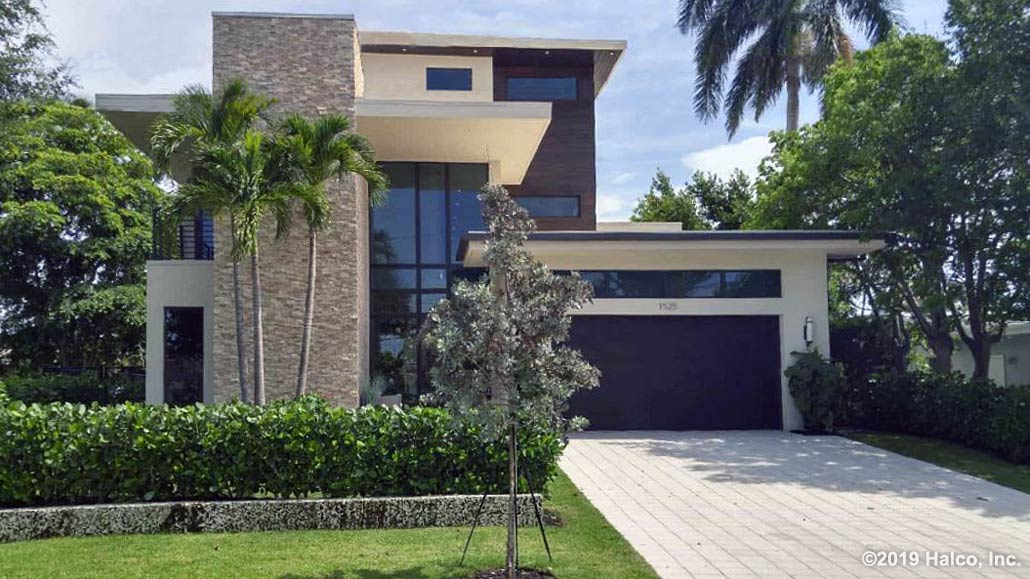 Contemporary, clean, and elegant, this custom tropical home was constructed in Brevard County, FL by Halco, Inc.